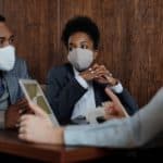 Masked Employee Meeting