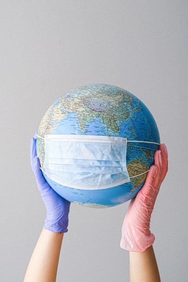 covid 19 test globe with mask